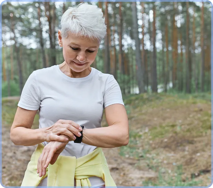 Woman checking glucose levels on Apple Watch