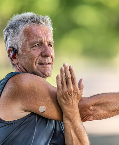 Man with CGM device on his arm
