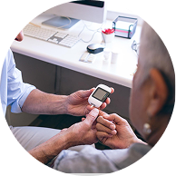 Doctor explaining to a woman how to measure glucose level