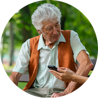 Man and woman in a park speaking about CGM